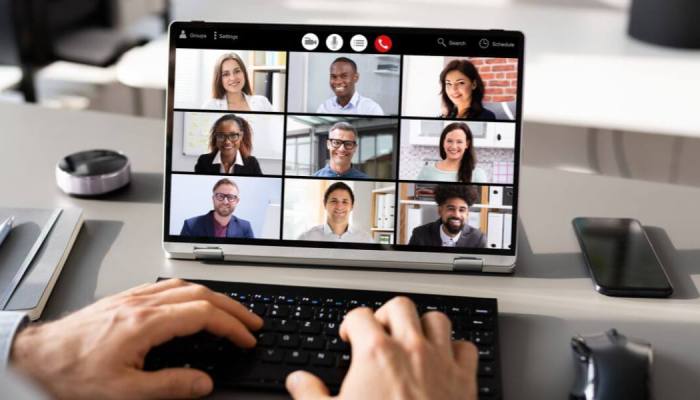 Zoom call on computer screen with 9 attendees.