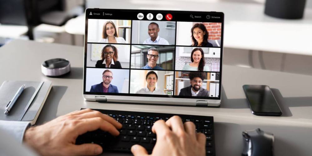 Zoom call on computer screen with 9 attendees.