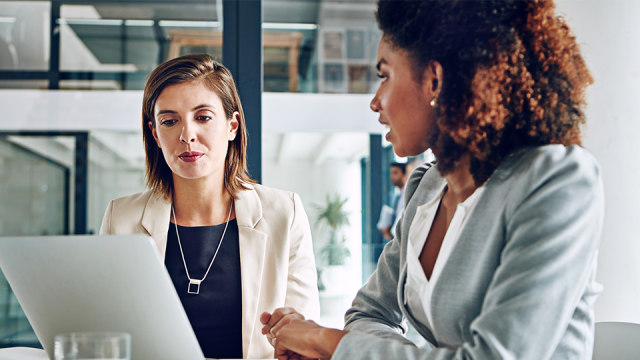 Image of women discussing Intuit's decision to stop selling some QuickBooks licenses.