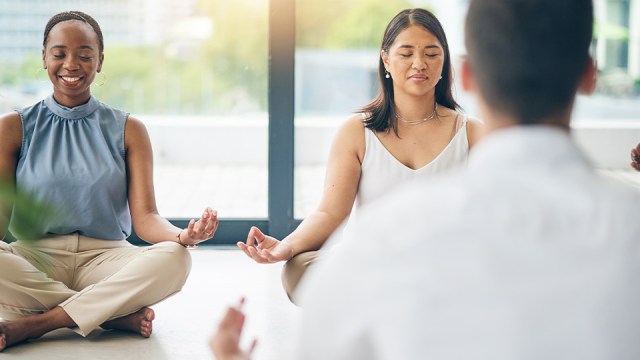 Image of a accounting firm staff taking time to meditate. 