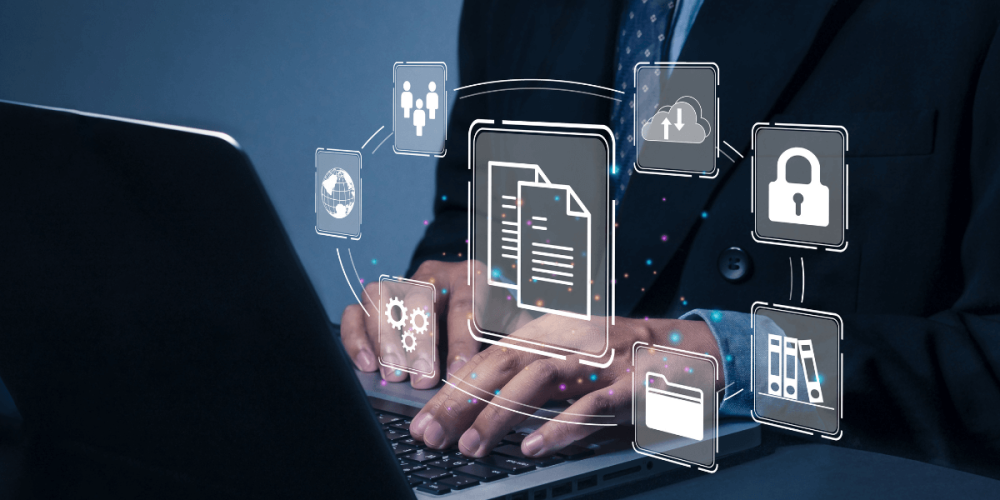 Man typing on his computer with graphics floating in front of the screen