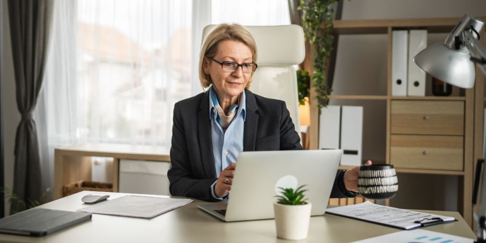 woman in office looking at computer.