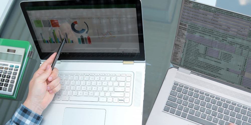 image of two screens showing quickbooks and spreadsheet